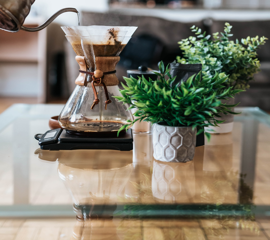 Gooseneck kettle pouring coffee into Chemex coffee maker